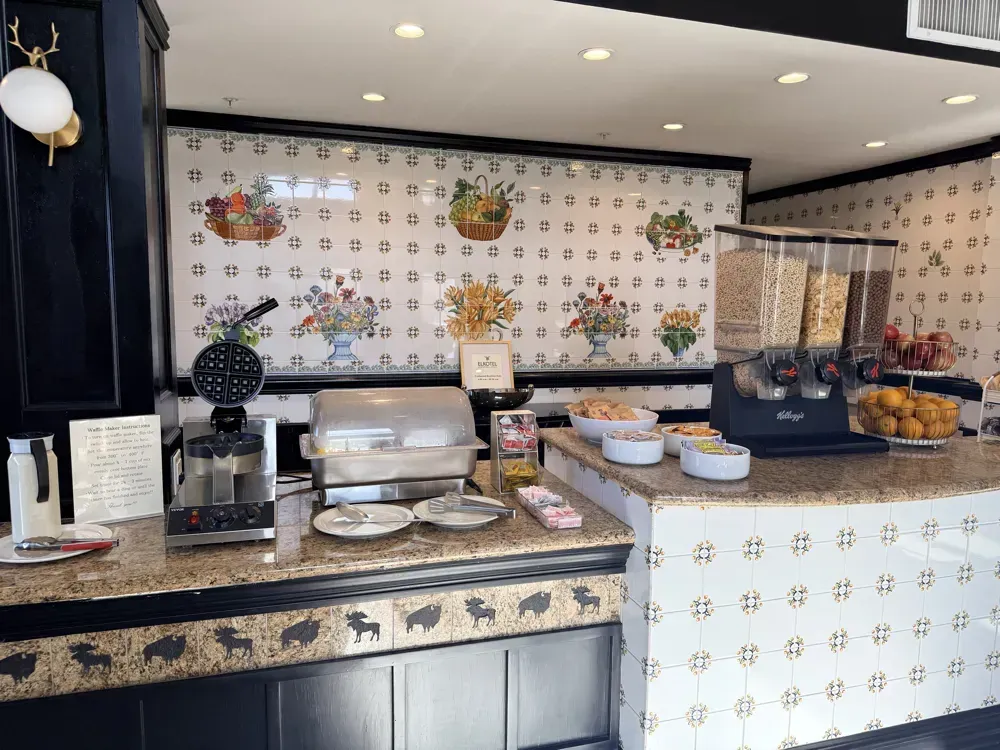 The hot breakfast counter with covered warming trays